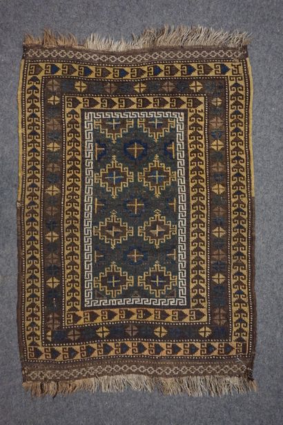 null Small carpet with geometric decoration on a brown background. 100x70 cm
