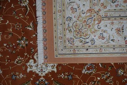 null Oriental carpet with vegetal decoration, with white central rose on a rusty...