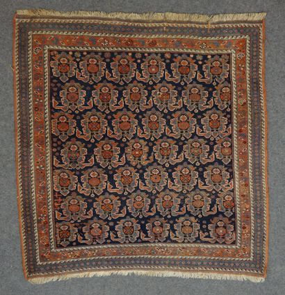 null Antique carpet with red decoration on navy blue background. 115x115 cm