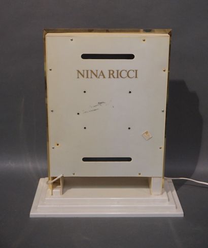 null Enseigne publicitaire lumineuse Nina Ricci en plastique (usures). 55 cm
