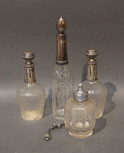 null Three crystal bottles with silver mounts and Baccarat crystal vaporizer (12.5...