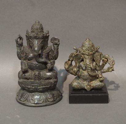 null Two Asian statuettes in brown patinated metal: "Ganesh sitting with four or...
