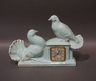 null Celadon earthenware Scout clock decorated with doves. 26x38x10 cm