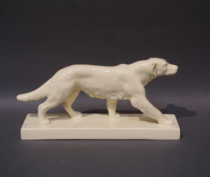 ODYV Ivory ceramic dog (restoration to ear, chip to base). 17x35x9 cm
