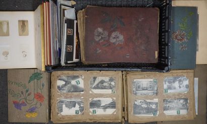 null Handle of postcards and albums. Two incomplete stamp albums are included.