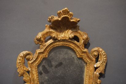 null Louis XV style wood and gilded stucco mirror with shell decoration (small chips,...