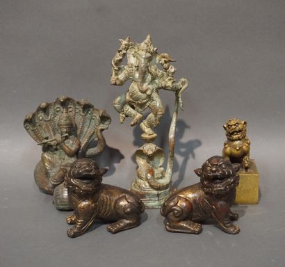 null Lot of a pair of metal Noh dogs, a Ganesh with six arms dancing on a green patinated...