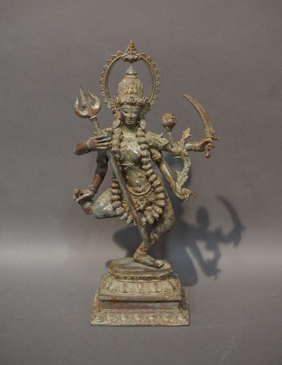 null Asian statuette in green patinated metal: "Dancer with four arms". 41x23x12...