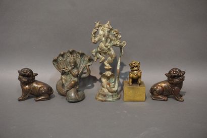 null Lot of a pair of metal Noh dogs, a Ganesh with six arms dancing on a green patinated...
