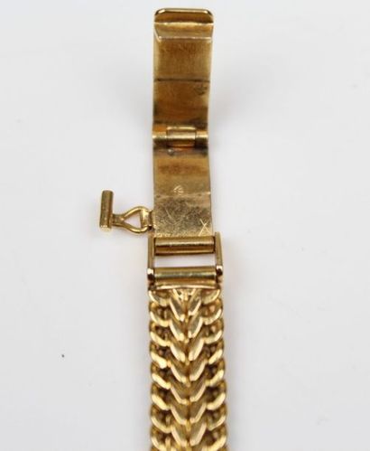 null Montre bracelet en or jaune, le cadran signé Giror.

L_18 cm

Poids brut: 22,63...