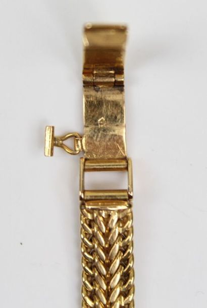 null Montre bracelet en or jaune, le cadran signé Giror.

L_18 cm

Poids brut: 22,63...