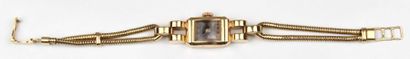 null Montre bracelet de dame et bracelet tubogaz en or jaune.

L_18 cm

Poids brut:...