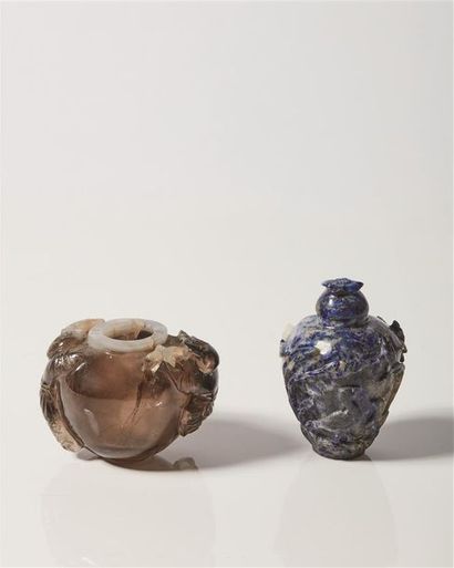 null CHINE, XXème siècle.

Deux petits vases en quartz fumé et lapis-lazuli.

Le...