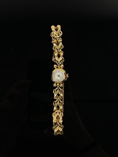null Montre de dame en or jaune, le bracelet en or jaune articulé.

L_ 16.9 cm.

Poids...