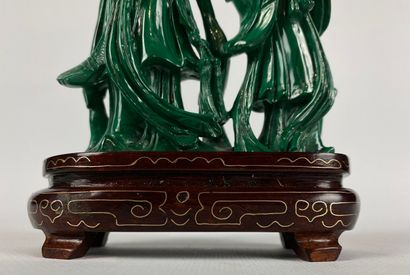 null CHINE.

Groupe en malachite sculptée figurant une déesse de printemps et un...