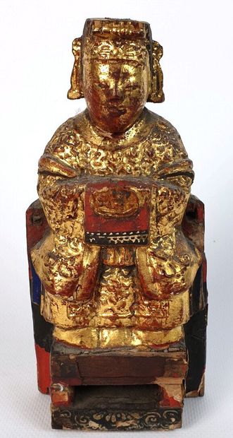 null CHINE DU SUD (?), vers 1900.

Statuette de dignitaire sur un trône en bois sculpté,...