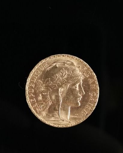 Une pièce de 20 francs or, 1912. 
6,46 grammes,...