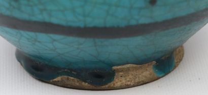 null Bottle vase

Siliceous paste with black decoration under a turquoise glaze

Iran,...