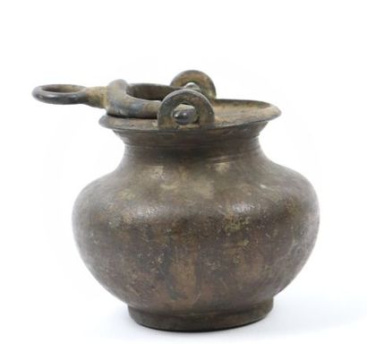 null Lota and oil lamp

Cast brass

India, 19th century

A lota with a globular body...