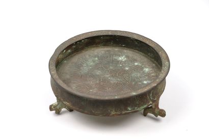 null Small tripod bowl

Bronze or cast brass

Iran, Seljuq period 

The inside is...