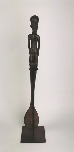 null Large spoon with beautiful black patina of use, kneeling female character of...