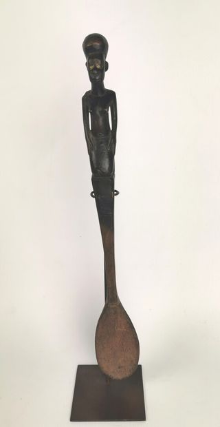 null Large spoon with beautiful black patina of use, kneeling female character of...