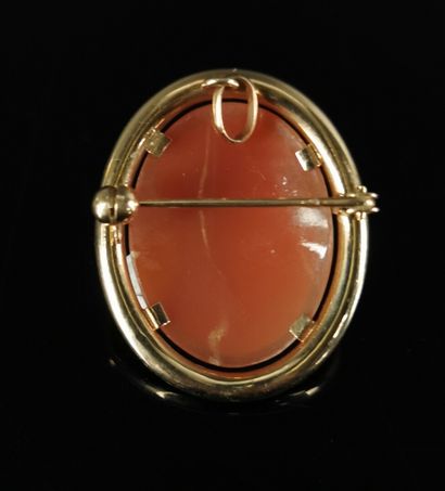 null A yellow gold brooch and pendant with a cameo showing two women in profile in...