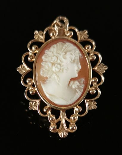 null A yellow gold brooch and pendant with a cameo showing two women in profile in...