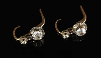 null Pair of yellow and white gold sleeper earrings set with white stones.

Gross...