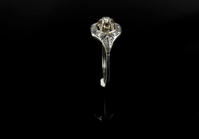 null White gold ring set with a brilliant-cut diamond weighing approximately 0.08...
