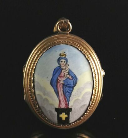 null A gold plated metal medallion with a polychrome enamel plate showing a Virgin...