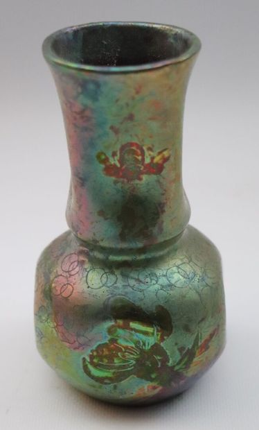 null AIRE-BELLE.

A baluster vase with iridescent glazed ceramic flats decorated...