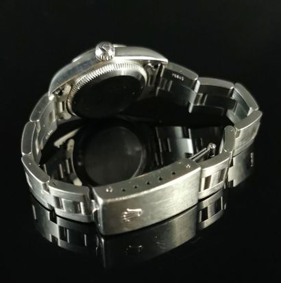 null ROLEX Oyster Perpetual de dame en acier.

Automatique.

Cadran saumon.

Bracelet...