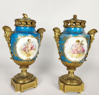 null Pair of cassolettes forming a perfume burner in porcelain, the mounts in gilt...