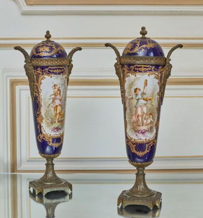 null SEVRES, in the taste of.

Pair of covered vases in bronze and porcelain with...