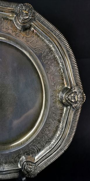 null MEXICO.

Silver dish chased and decorated with repeated masks in relief, engraved...