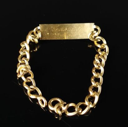 null Bracelet gourmette in yellow gold, decorated with a rectangular curved plate...