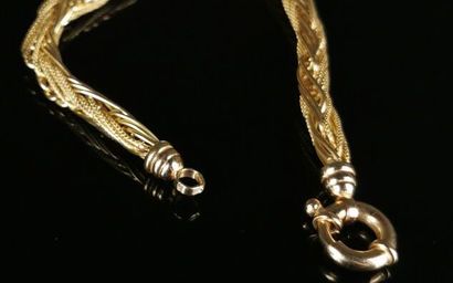 null Yellow gold necklace made of braided chains. 

L_ 45 cm.

22.95 grams, 18K,...