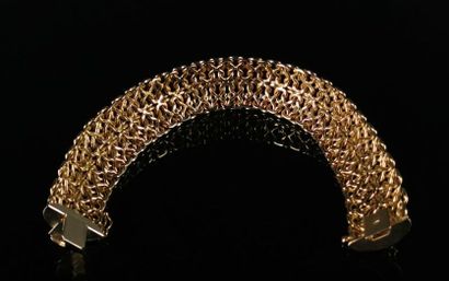 null Flexible bracelet in two-tone gold, openwork. 

L_22 cm.

28.76 grams, 18K,...
