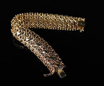 null Flexible bracelet in two-tone gold, openwork. 

L_22 cm.

28.76 grams, 18K,...