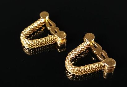 null Pair of yellow gold cufflinks with a braid pattern.

L_2 cm.

17.88 grams, 18K,...