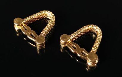 null Pair of yellow gold cufflinks with a braid pattern.

L_2 cm.

17.88 grams, 18K,...