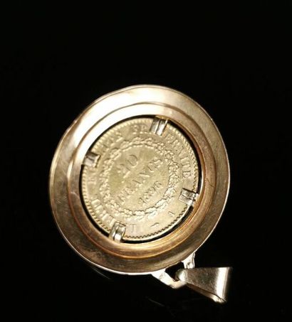 null Yellow gold medallion pendant with a 20 franc genie coin in the center. 

9.74...