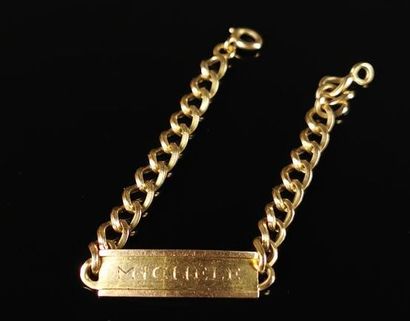 null Bracelet gourmette in yellow gold, decorated with a rectangular curved plate...