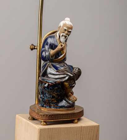 null CHINA.

Subject representing a fisherman in enamelled stoneware.

The lamp mount...
