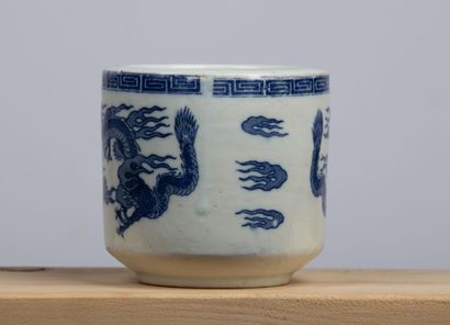 null VIETNAM, circa 1900.

White-blue enameled porcelain brush pot decorated with...