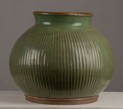 null CHINA, 20th century.

A celadon glazed porcelain vase with a straight neck,...