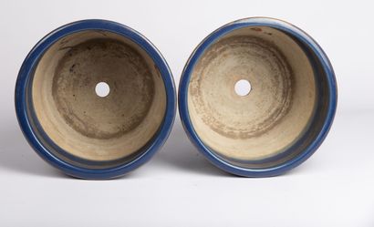 null CHINA, 20th century. 

Pair of blue glazed stoneware planters with rotating...