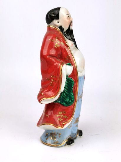 null CHINA, 20th century. 

Porcelain statuette enamelled polychrome and gold representing...