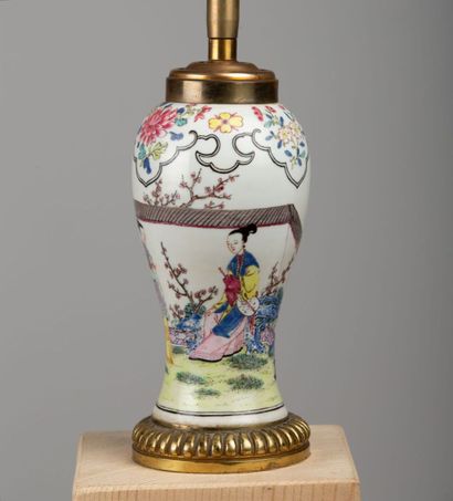 null CHINA, 18th century.

Porcelain vase with polychrome decoration of a man spying...